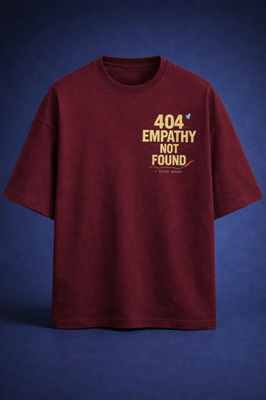 Maroon oversized streetwear t-shirt with "404 Empathy Not Found" text print on front, minimal graphic design, premium cotton look
